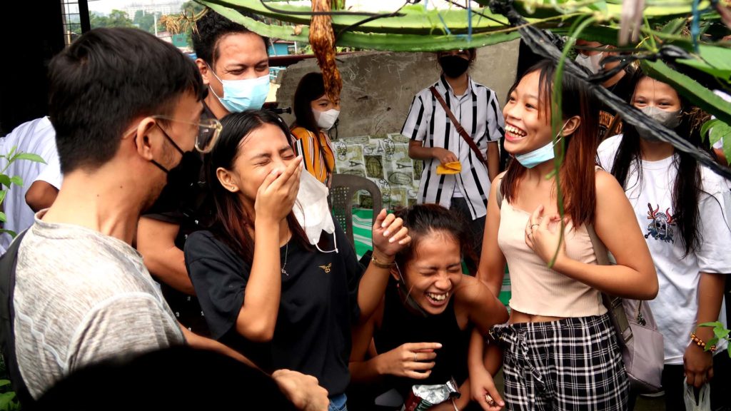 Filipino children laughing and talking with one another